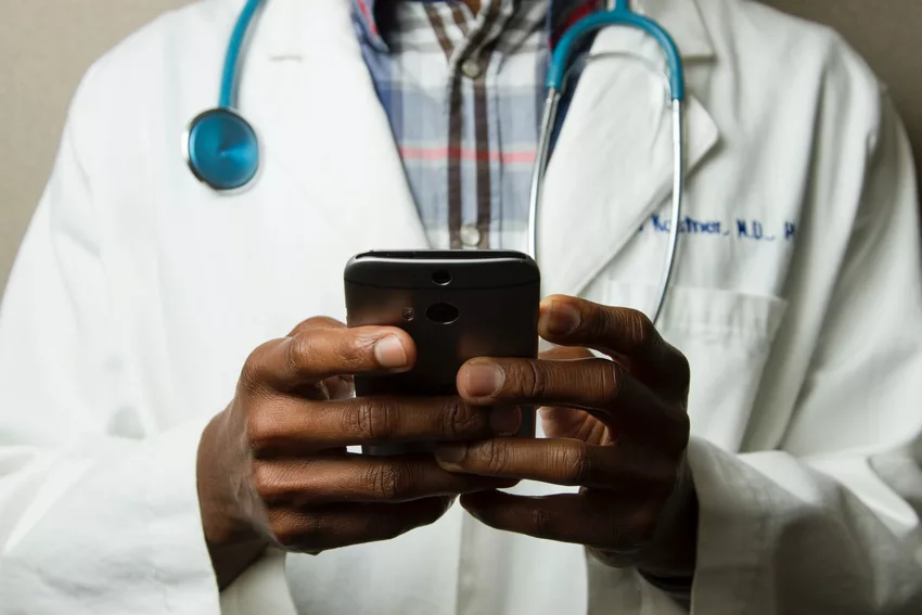 Healthcare Professional holding a mobile phone